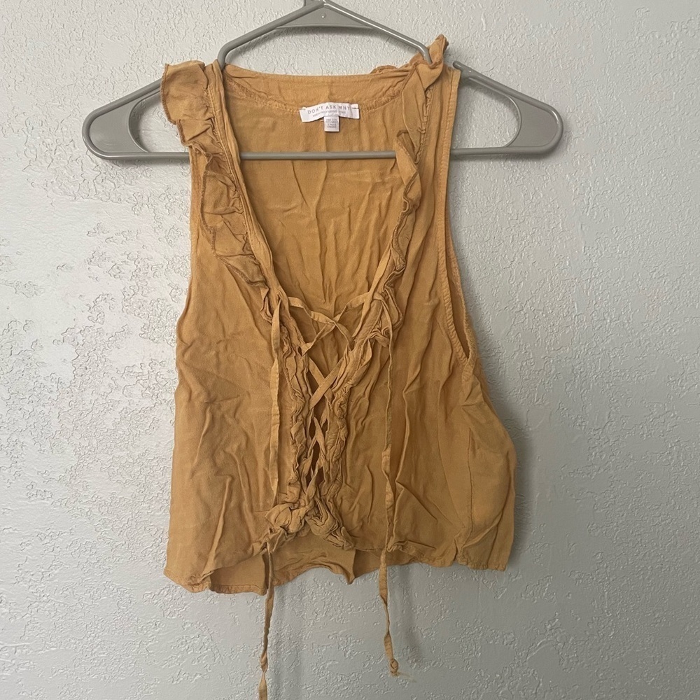Don’t ask why golden colored cropped top